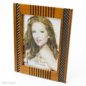 Wooden <em>photo</em> <em>frame</em> with carved pattern for decor